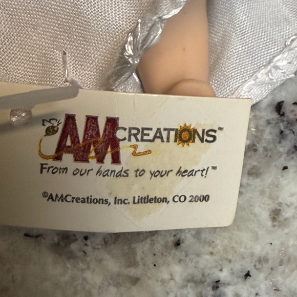 Porcelain Angel Doll with Golden Hair and Iridescent Wings - Picture 5 of 6